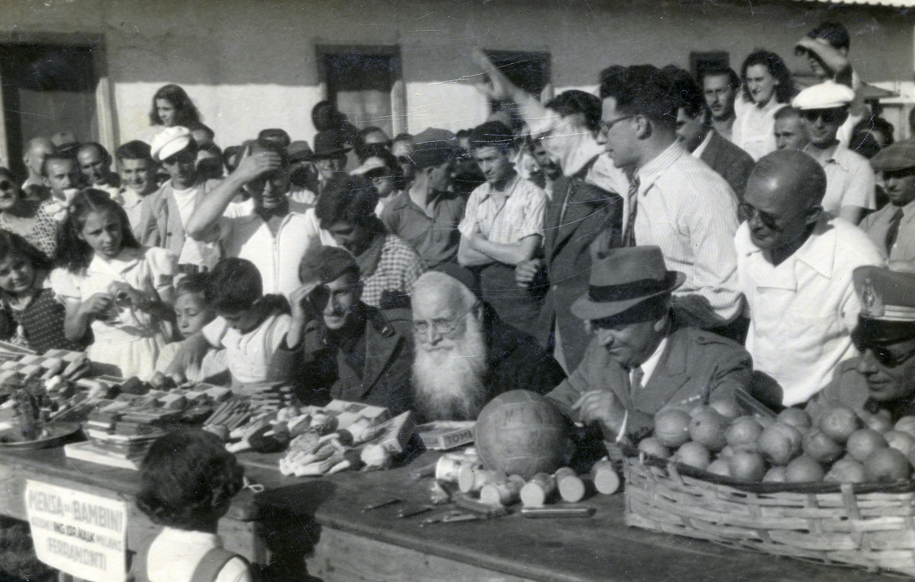 Internees surrounding a table located in Ferramonti di Tarsia 1942-1944
