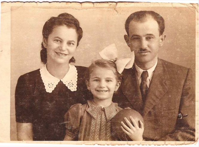Family portrait, girl with ball.