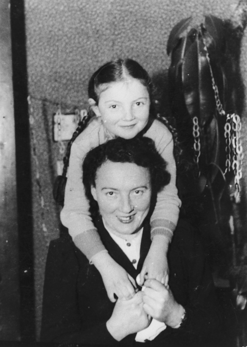 Young girl embracing her mother, 1939